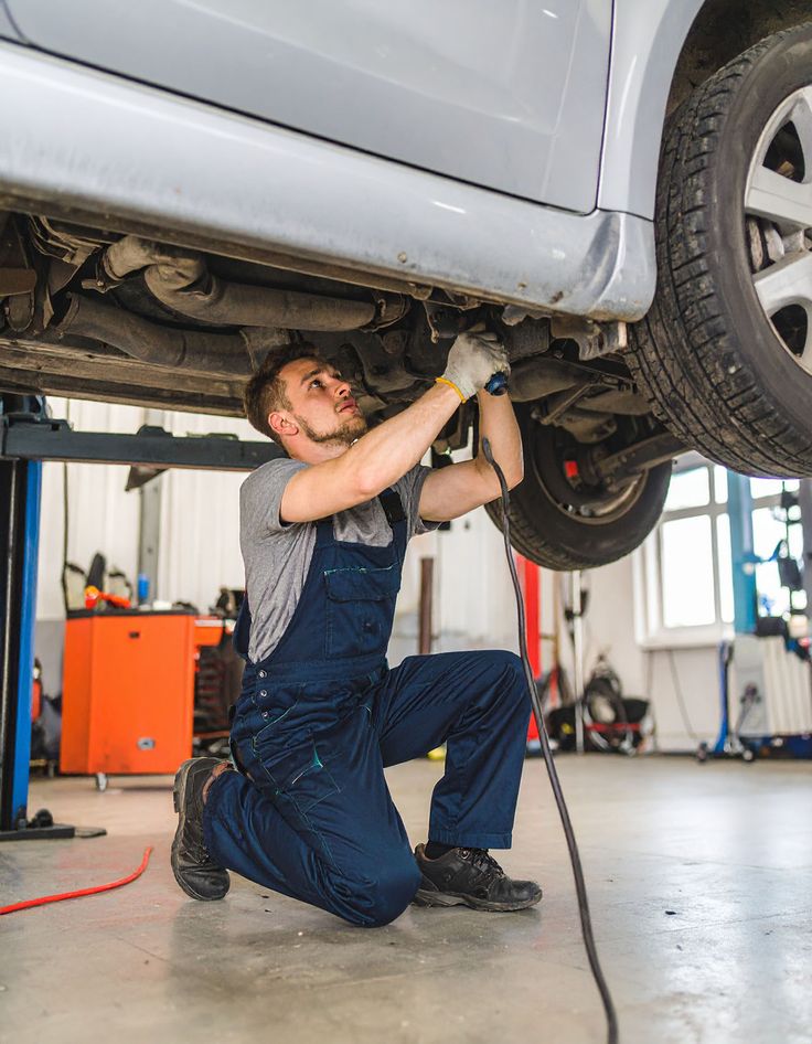 Vans Parts Midlands technician fitting parts under a van